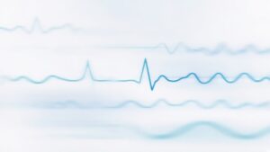 Soft abstract ECG waveform in blue and teal, with no readable text